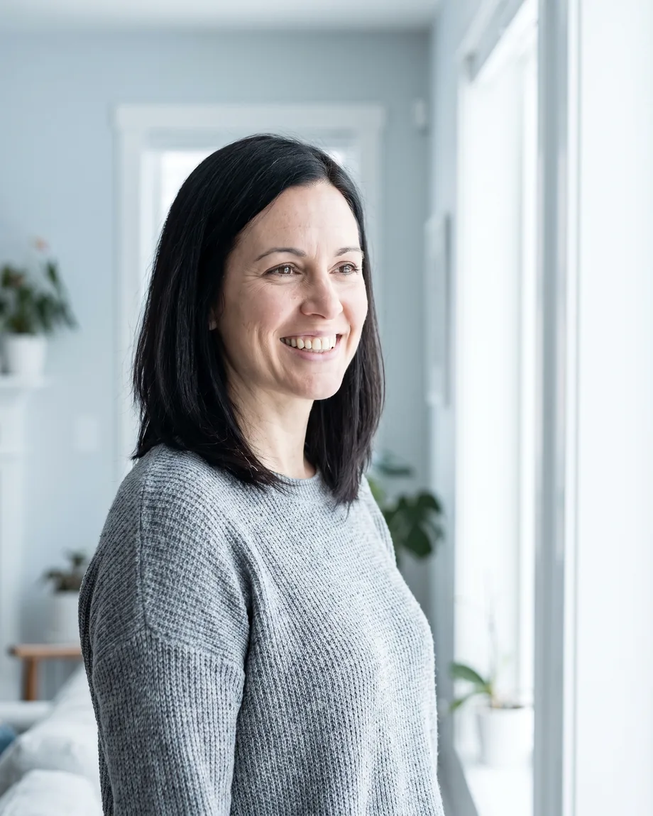 Professional Teeth Whitening in Dundee, MI. A woman with a natural, confident smile in a bright room.